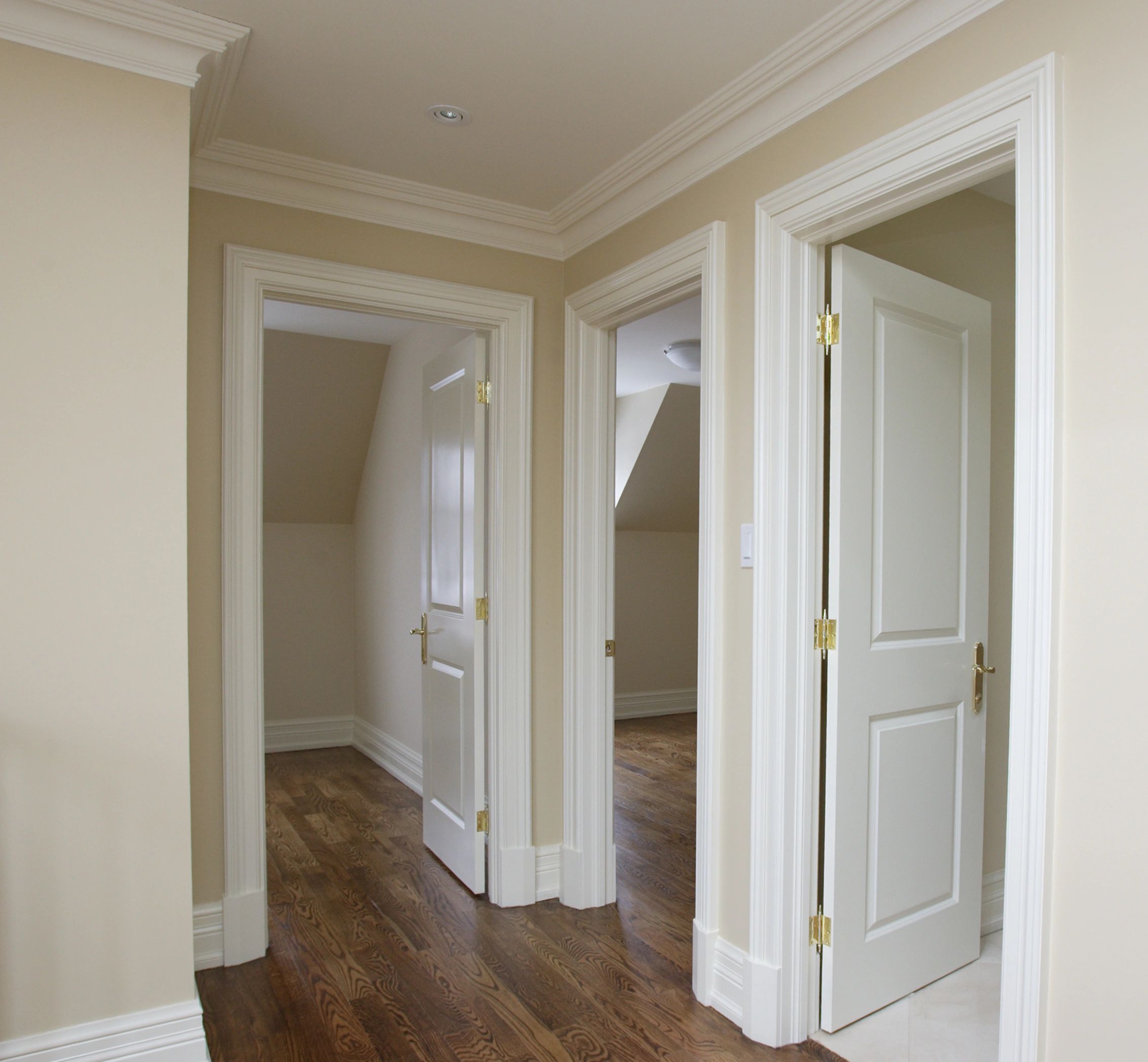 Interior door installation with baseboard trim and crown molding — JKV Contractors, Salt Lake County